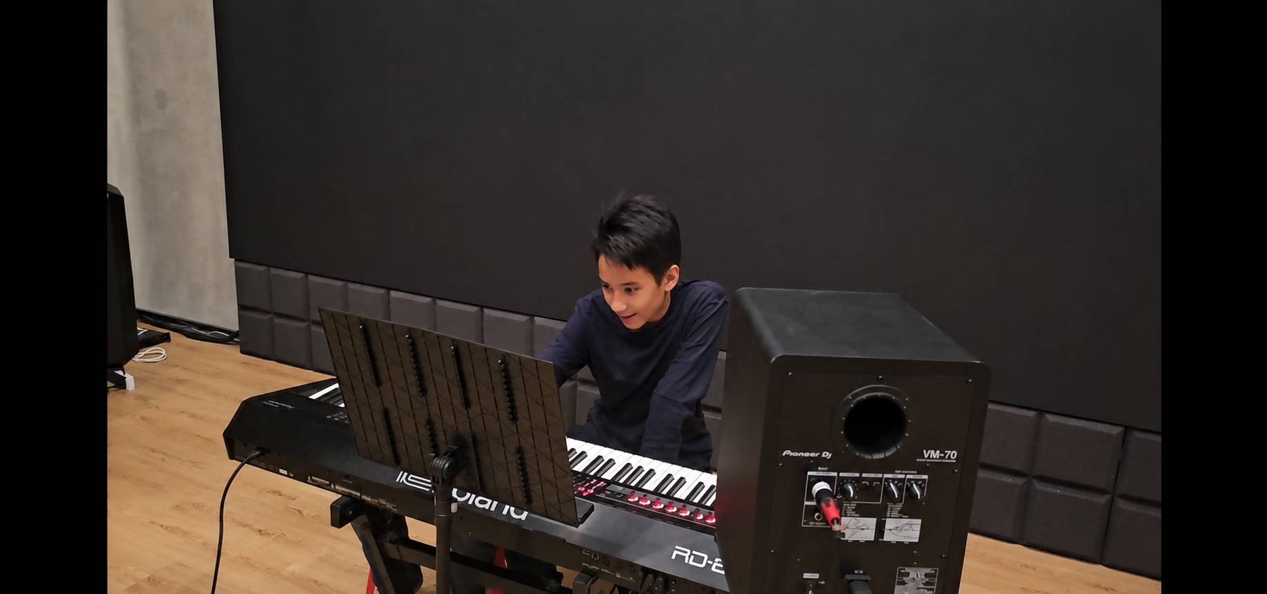Matt creating music at a keyboard